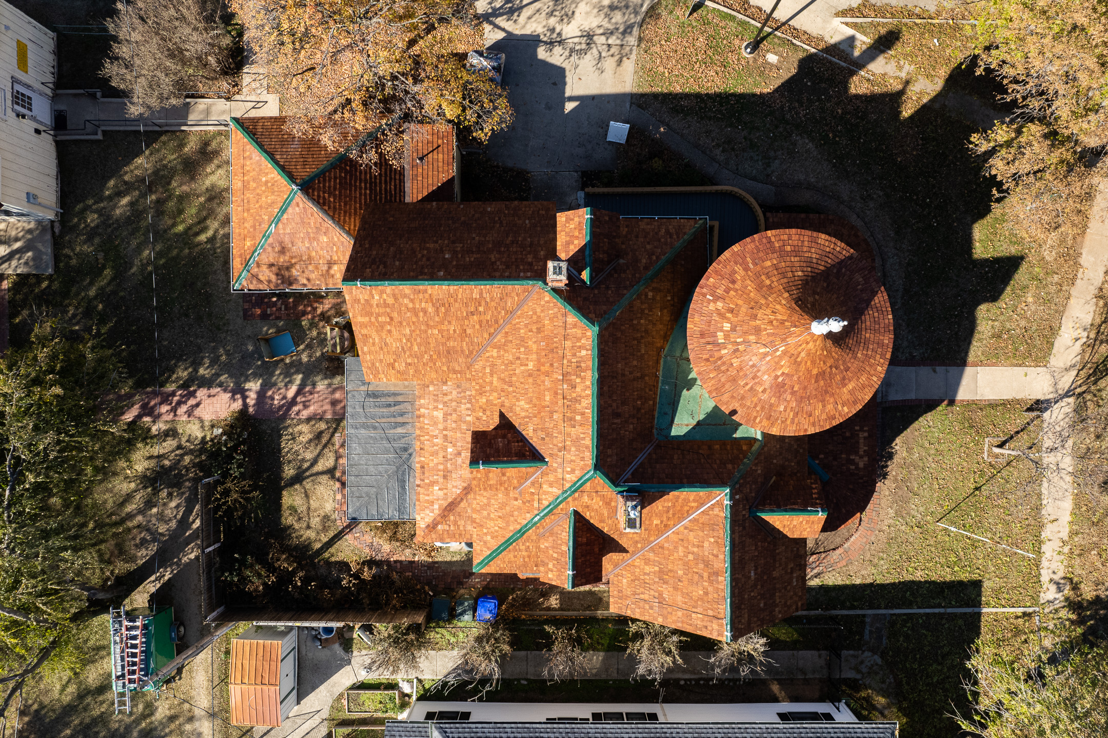 Arial drone view of roofing project on Victorian home. Renovation by Brent Swift + SwiftCo in Norman, Oklahoma. Purpose is to show our quality of work.